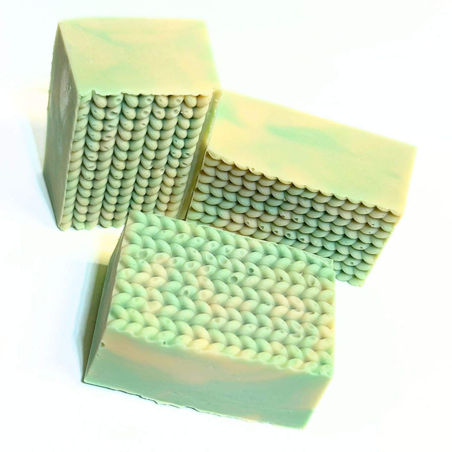 Three Cashmere Bliss bars displayed together to highlight the knit-style textured tops.