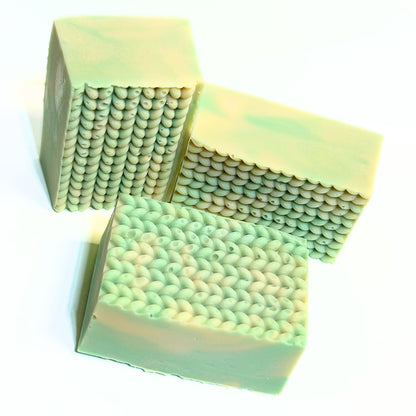 Three Cashmere Bliss bars displayed together to highlight the knit-style textured tops.