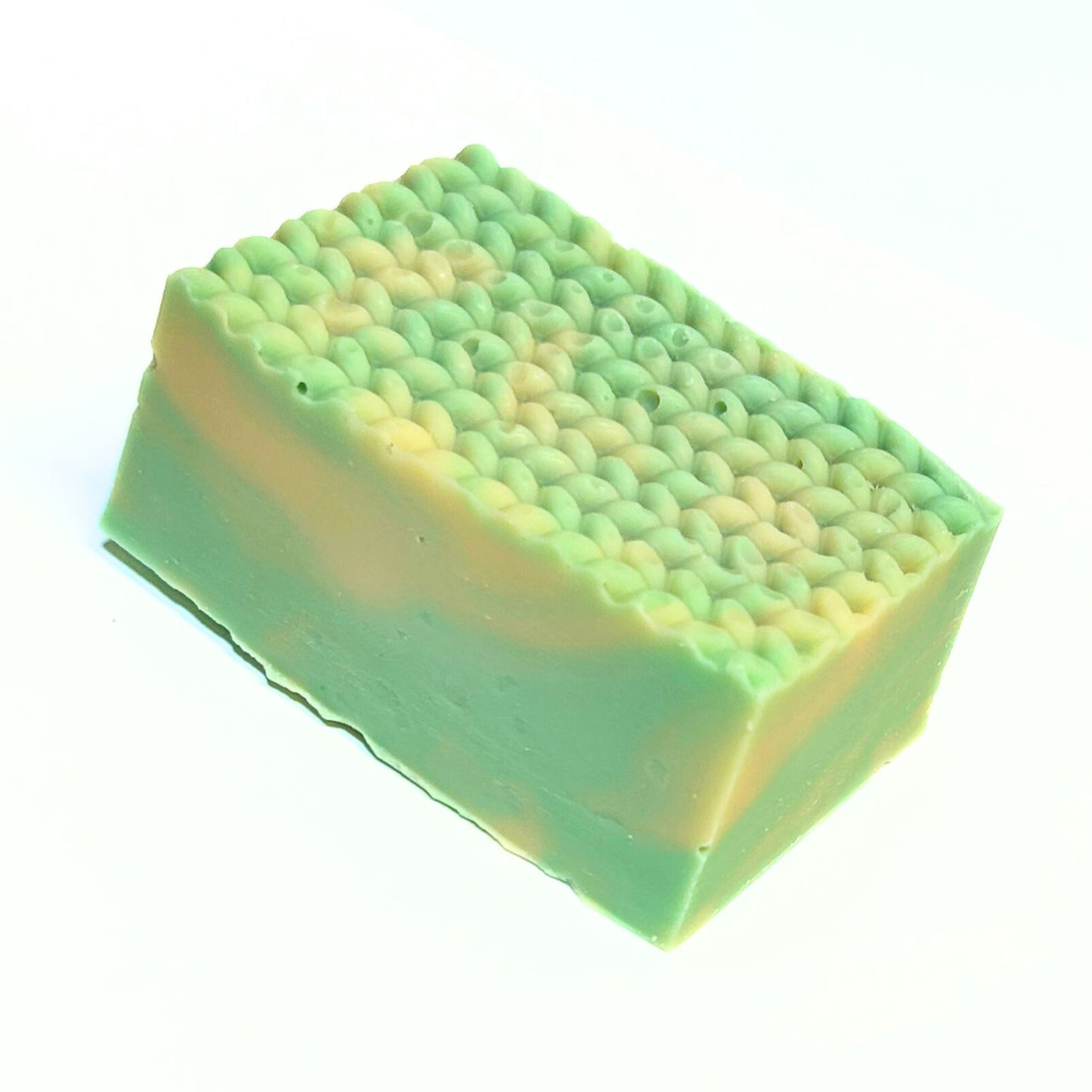 Side-angle close-up of an unwrapped Cashmere Bliss soap bar.
