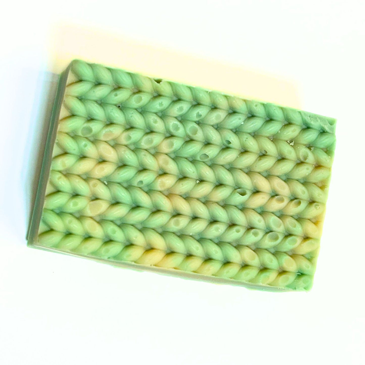 Top view of Cashmere Bliss bar showing the sweater-inspired texture pattern.