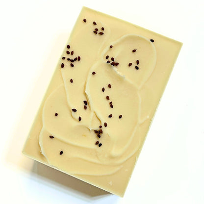 Top angled view of an unwrapped Cranberry soap bar showing smooth sides and top texture.