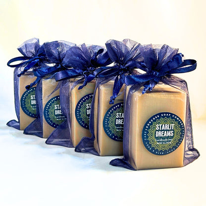Five Starlit Dreams vegan handmade cold process soap bars in navy organza bags, displayed diagonally with Concord Soap Company product labels.
