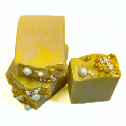 Angled top view of Apple Honey Champagne soap bars with gold shimmer and pearl accents.