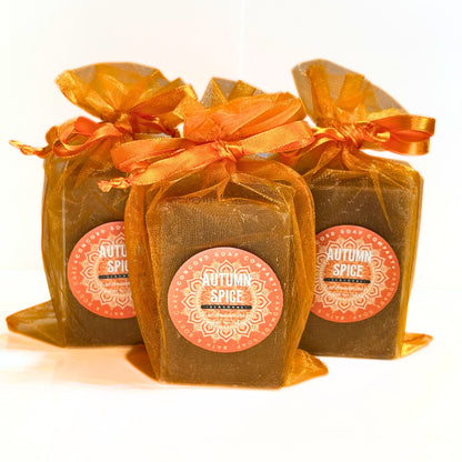Front view of three Autumn Spice soaps in orange organza gift bags.