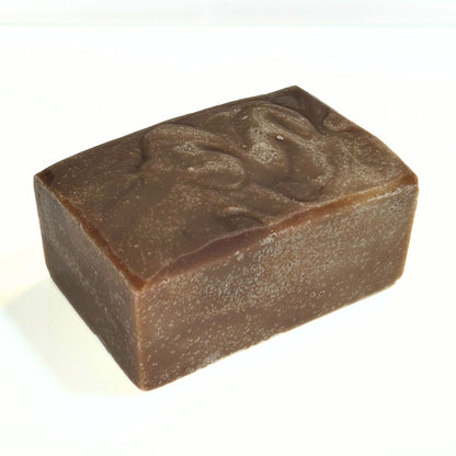 Single unwrapped Autumn Spice soap bar on white background.