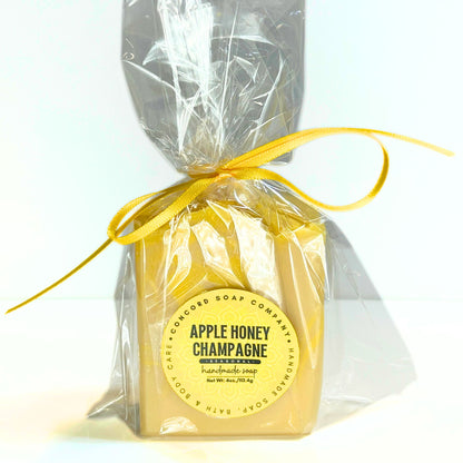 Single Apple Honey Champagne soap bar wrapped in cello bag with yellow ribbon.