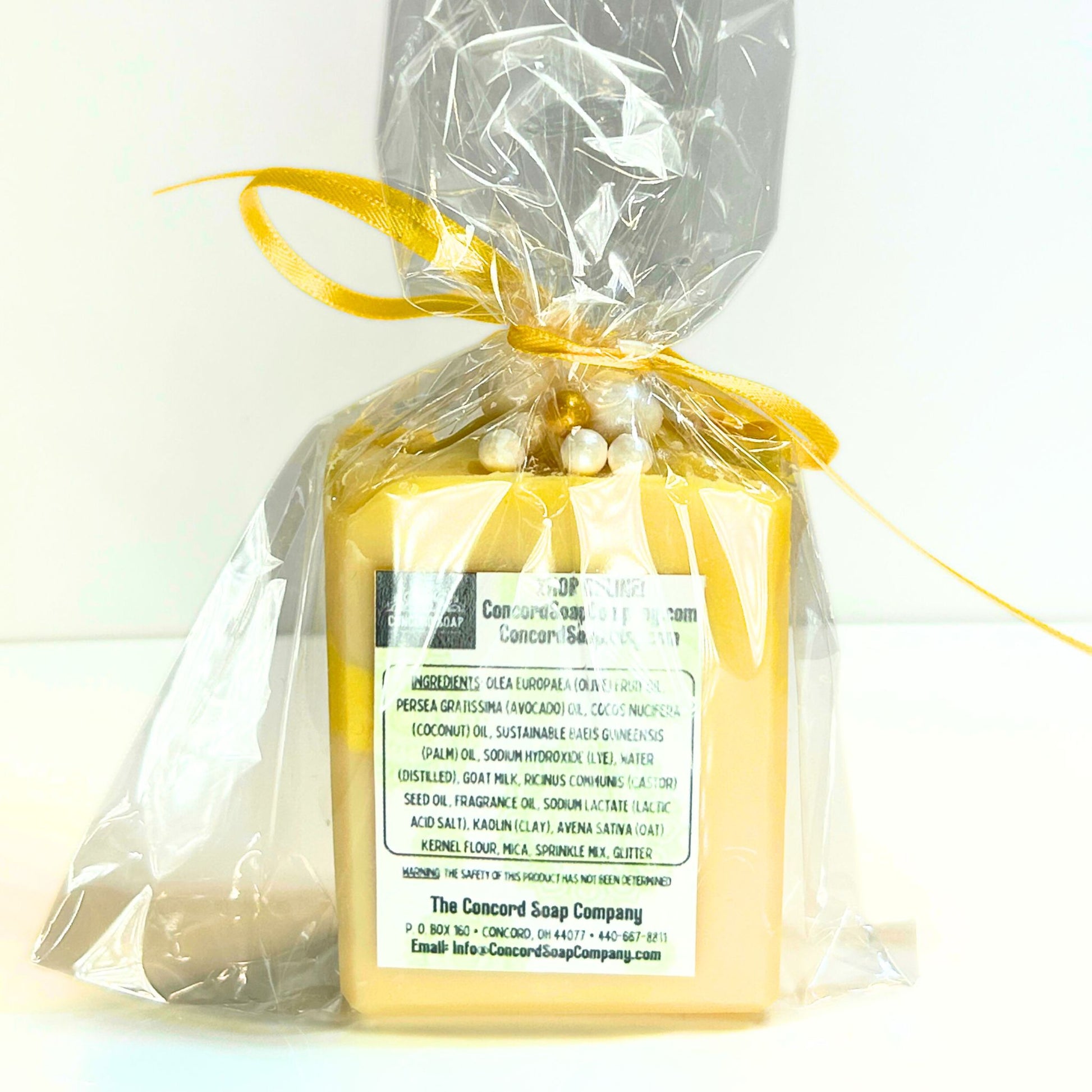 Back view of cello-wrapped Apple Honey Champagne soap showing ingredient label.
