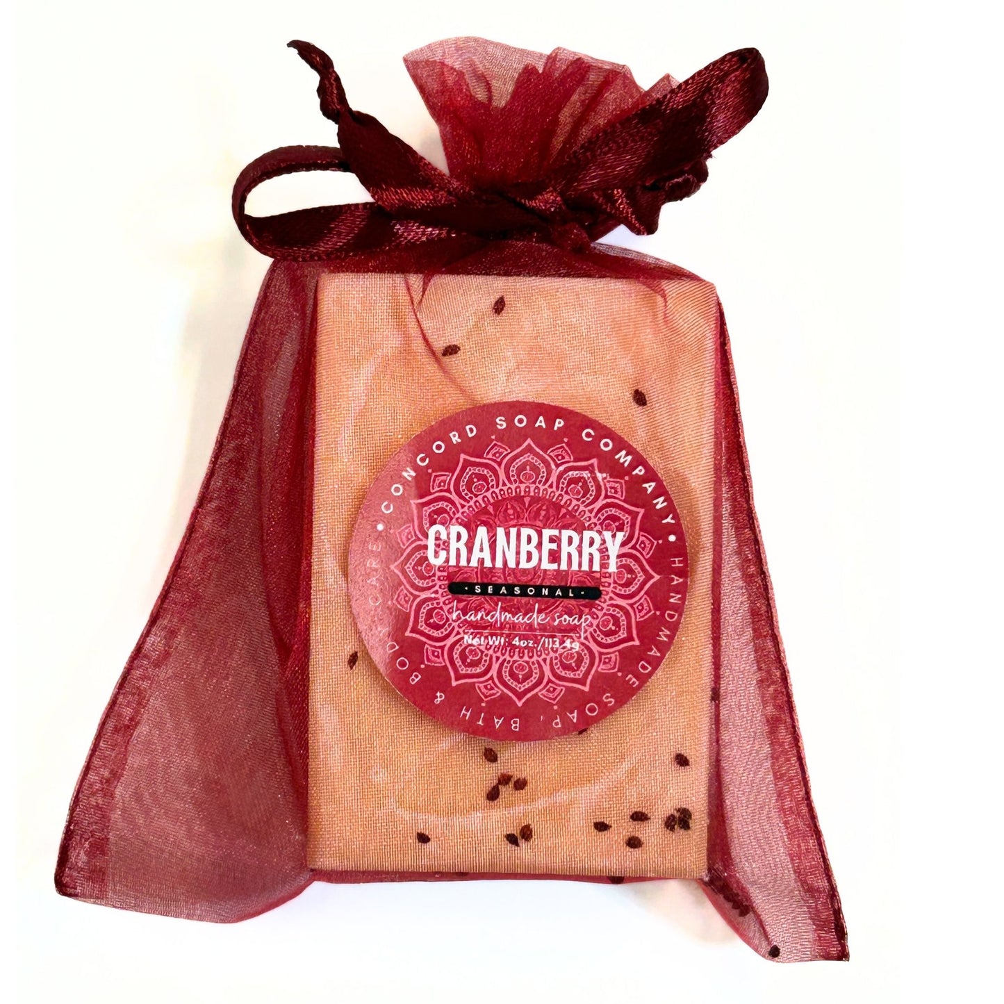 Front view of a single Cranberry soap bar wrapped in a burgundy organza bag.