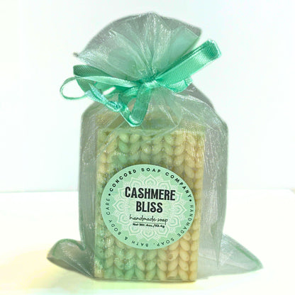 Single Cashmere Bliss soap bar wrapped in an aqua organza drawstring bag.