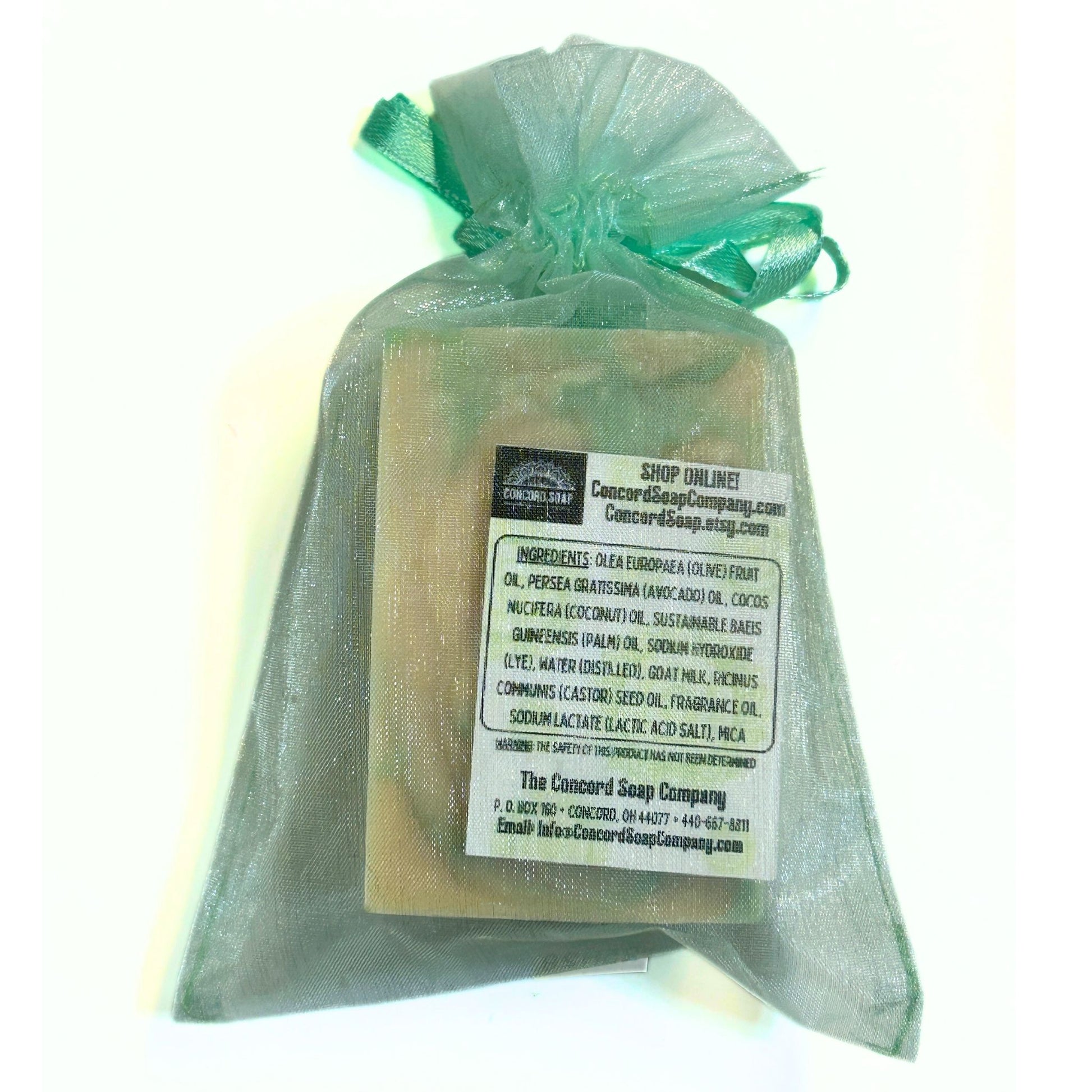 Flat lay, rear view of Cashmere Bliss soap in organza bag showing ingredient label.