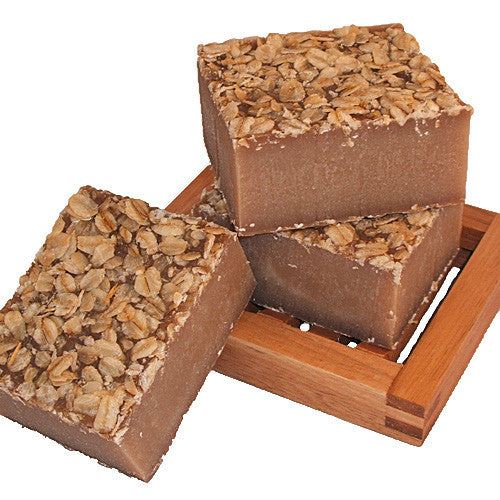 Handmade Oatmeal, Milk and Honey Soap on wooden soap dish